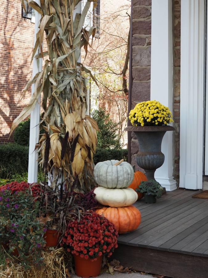 Fall porch decorated with pumpkins